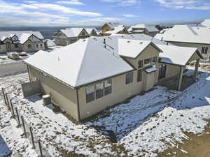 Snowy aerial view with a residential view