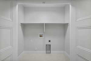 Laundry area featuring washer hookup and electric dryer hookup