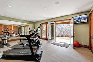 Workout room off the downstairs game room with walkout French doors and great views