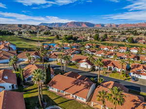 Aerial view of a mountain backdrop and a golf club