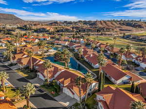 Aerial view of residential area featuring a water and mountain view