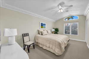 Bedroom featuring light colored carpet and ceiling fan
