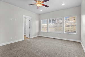 Spare room with light carpet, ceiling fan, and recessed lighting