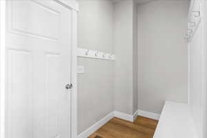 Mudroom with baseboards and light wood-style floors