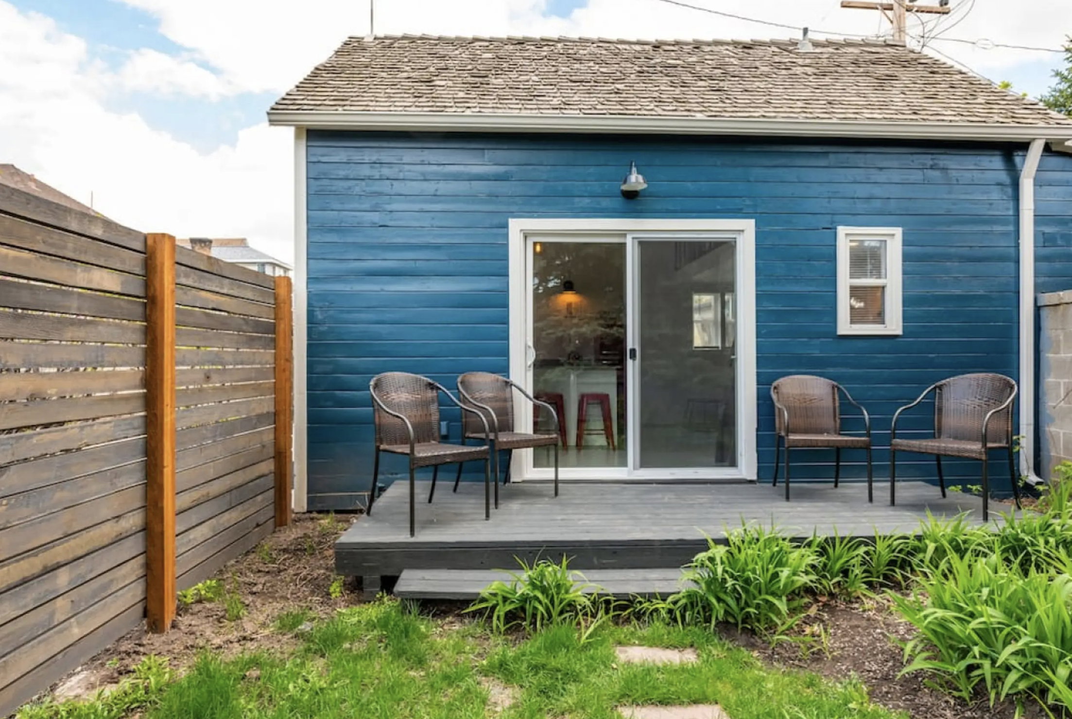 Rear view of house featuring a wooden deck