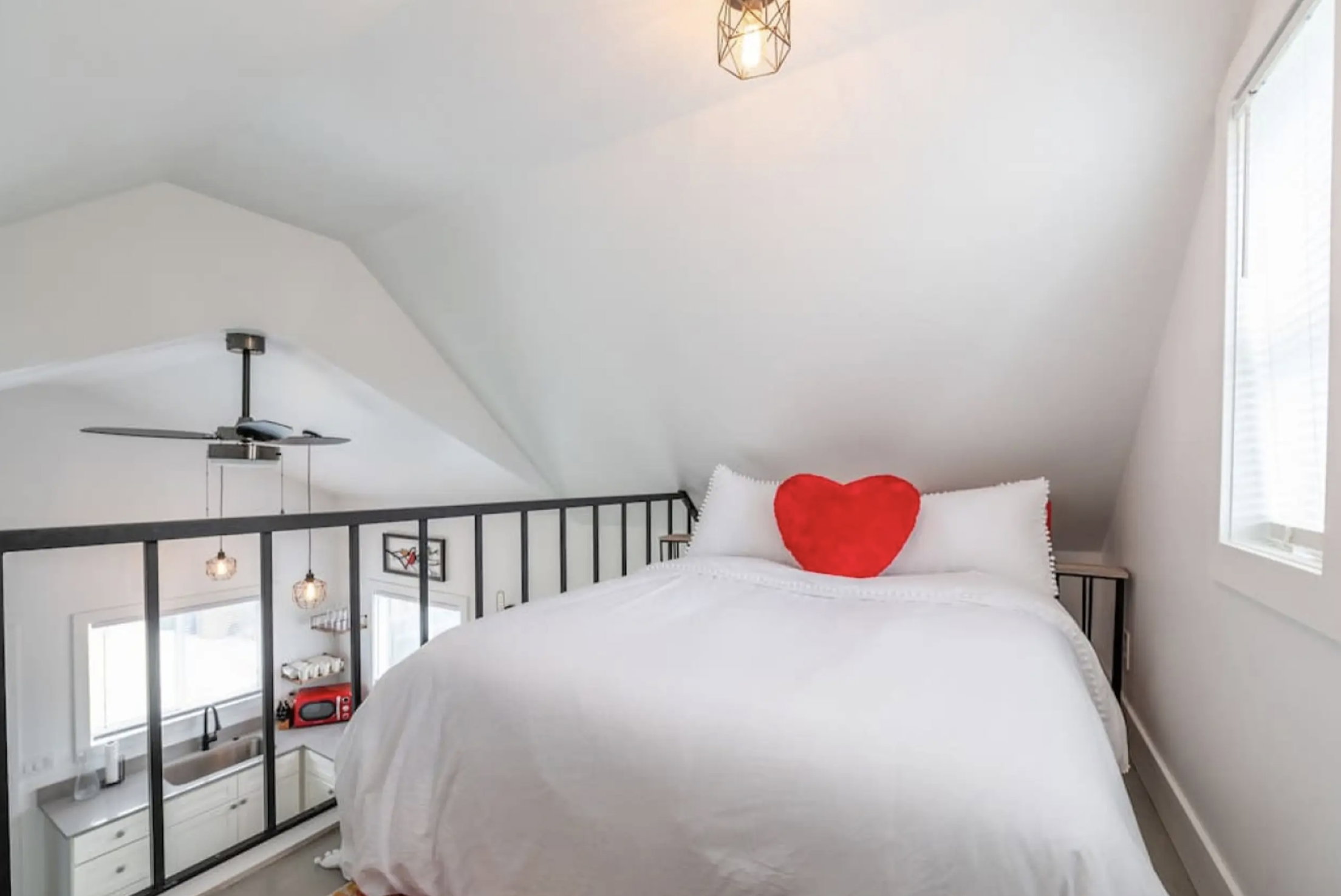 Bedroom with multiple windows and vaulted ceiling