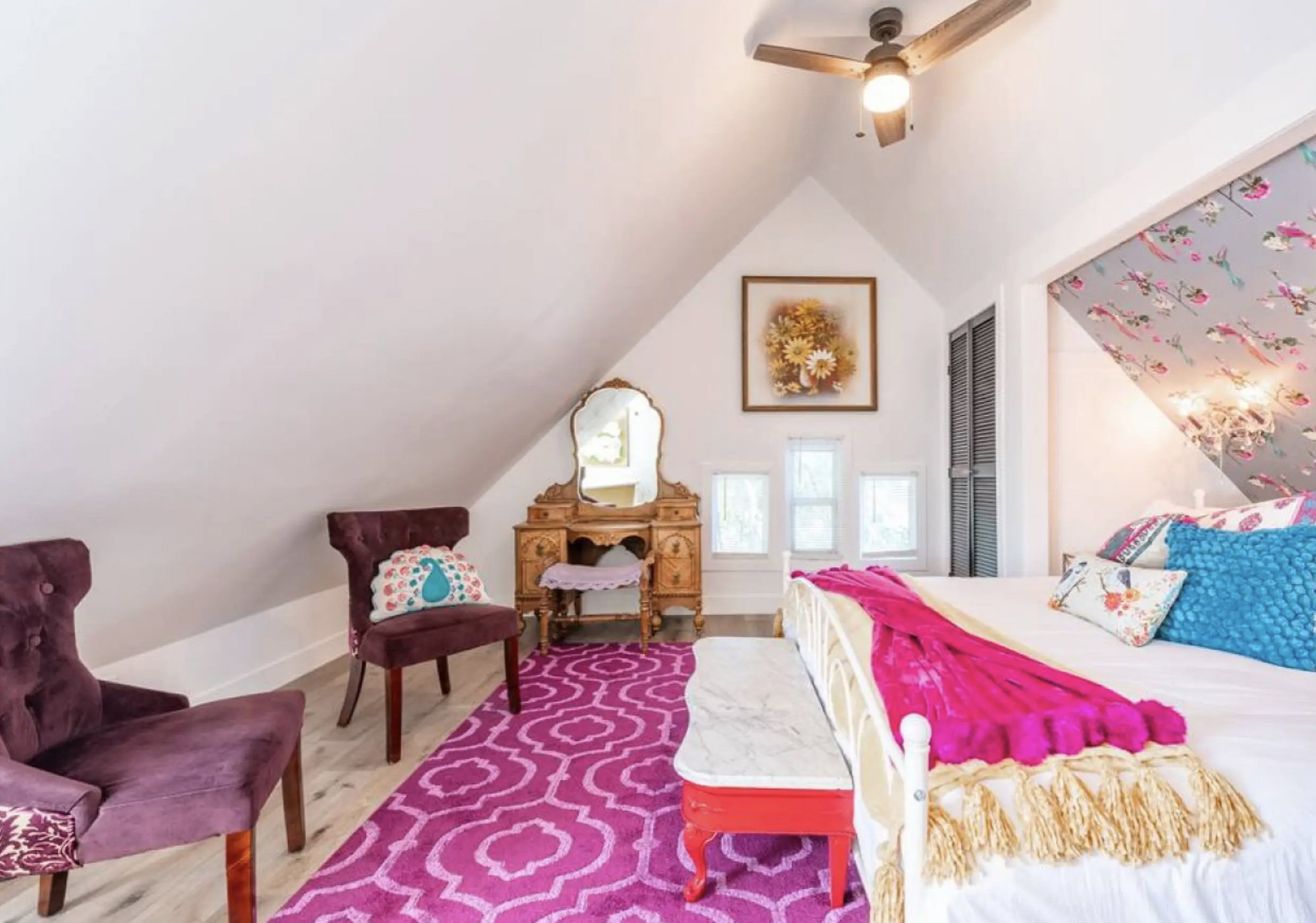 Bedroom with vaulted ceiling, a closet, ceiling fan, and wood finished floors