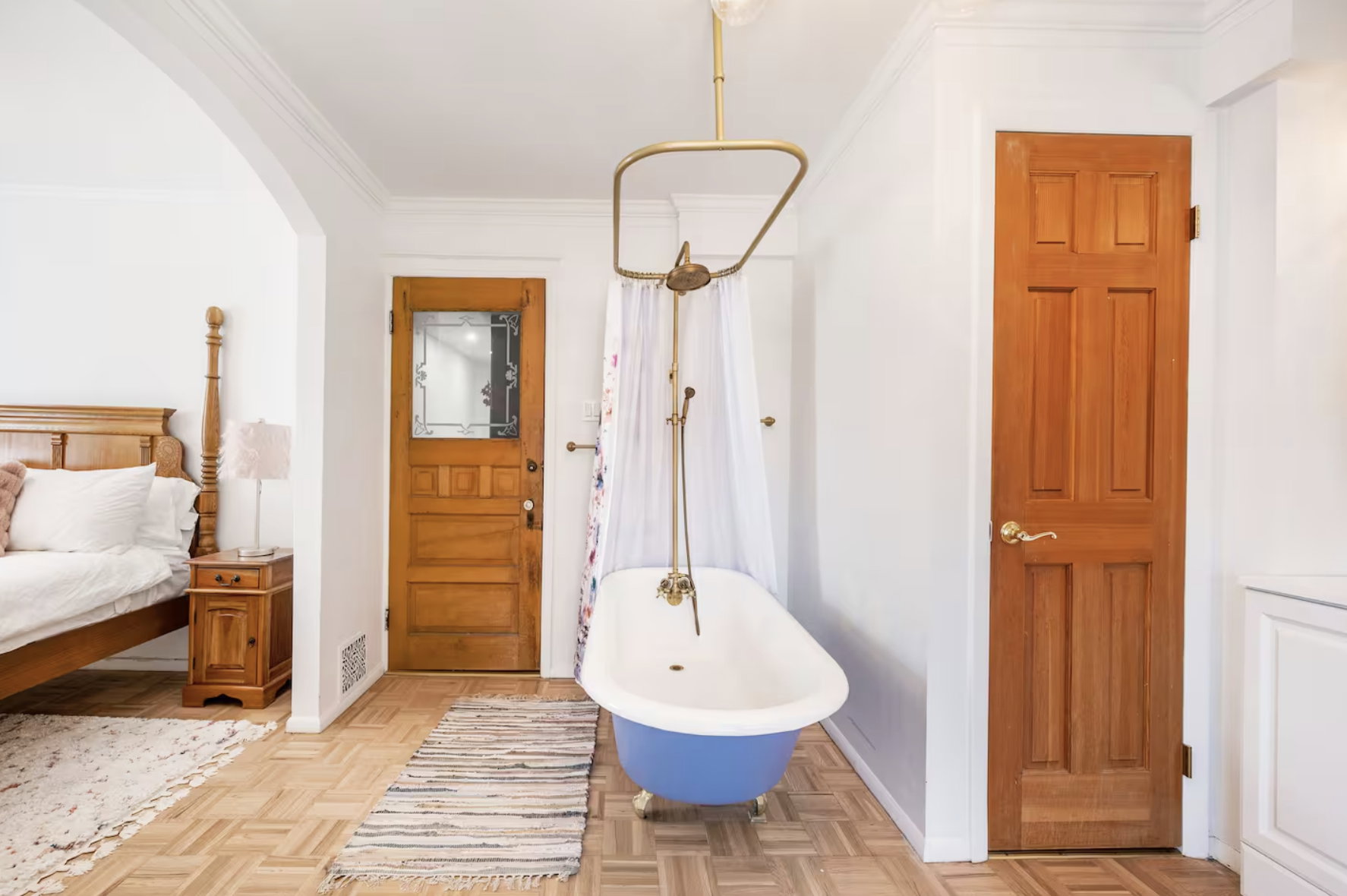 Entryway featuring arched walkways, ornamental molding, and parquet floors