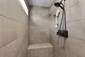 Bathroom view of a tile shower