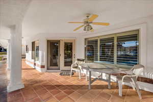View of patio featuring a ceiling fan and outdoor dining area