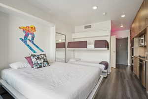 Bedroom featuring dark wood finished floors and recessed lighting