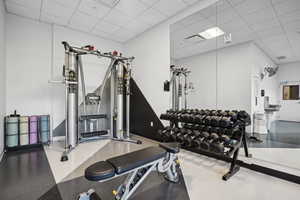 Workout area with a paneled ceiling