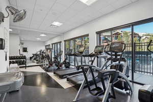 Gym with a paneled ceiling