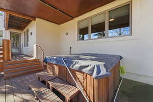 Wooden deck with a hot tub