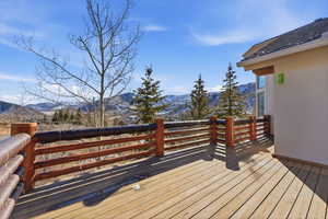 Wooden deck featuring a mountain view