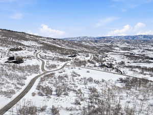 Snowy aerial view with a mountain view