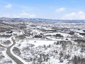 Snowy aerial view featuring a mountain view