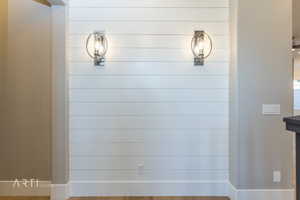 Bathroom featuring tiled shower and wood finished floors