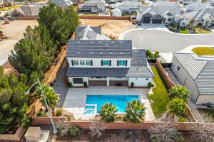 Aerial view of residential area featuring a pool