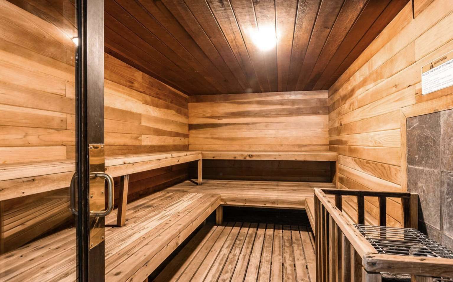 Sauna with wooden ceiling and wooden walls
