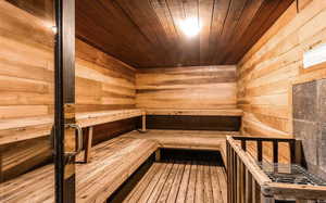 Sauna with wooden ceiling and wooden walls