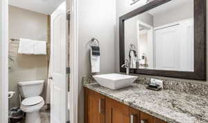 Bathroom featuring vanity and toilet