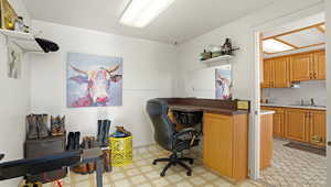 Office area with light flooring and a sink