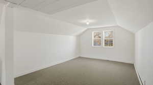 Bonus room featuring carpet and baseboards