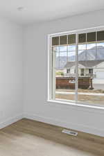 Unfurnished room featuring light wood-style flooring and a mountain view