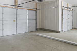 Garage featuring a garage door opener
