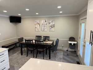 Dining room with recessed lighting, dark wood-style floors, and ornamental molding