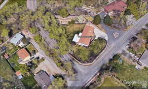 Aerial view of property's location featuring nearby suburban area