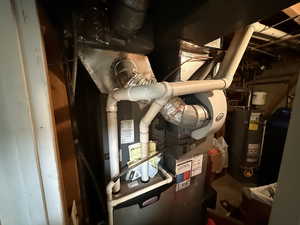 Utilities featuring water heater and heating unit