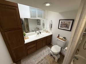 Bathroom featuring vanity and shower / bath combo