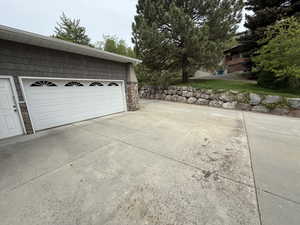Garage featuring concrete driveway