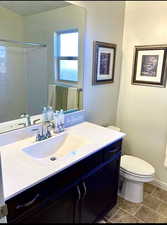 Bathroom with vanity and a shower