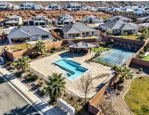 Aerial perspective of suburban area with a pool