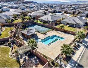 Aerial view of residential area featuring a pool area