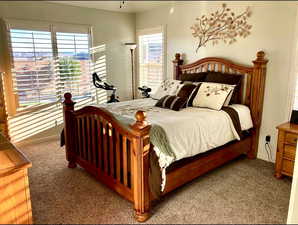 Carpeted bedroom featuring baseboards