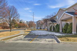 View of street featuring a mountain view, sidewalks, and curbs