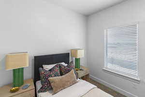 Carpeted bedroom featuring baseboards