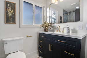 Bathroom with vanity and a shower