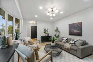 Living room featuring light wood-style flooring and hanging lights