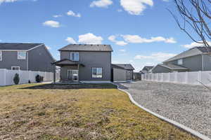 Rear view of property with a patio, a fenced backyard, and stucco siding
