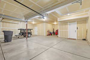 Garage featuring a garage door opener