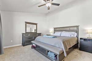 Bedroom featuring light carpet and ceiling fan
