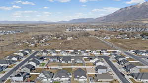 View of property location featuring nearby suburban area and a mountainous background