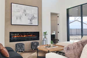 Living room featuring a glass covered fireplace