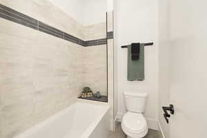 Full bath with toilet and washtub / shower combination