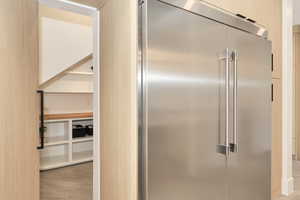 Kitchen view of built in refrigerator